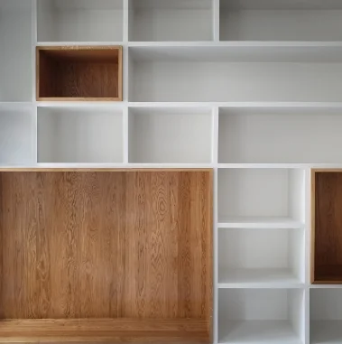 White closet shelving with warm wood-grain accent cubbies